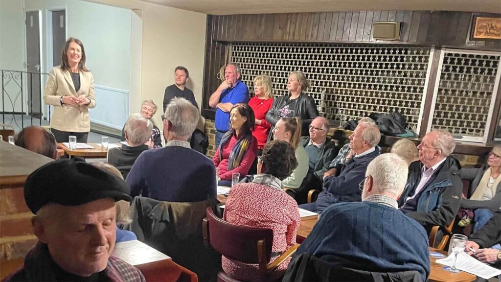 Monica Harding MP speaking at Hurst Park Residents Association Annual General Meeting at Royal British Legion with residents and committee members in attendance