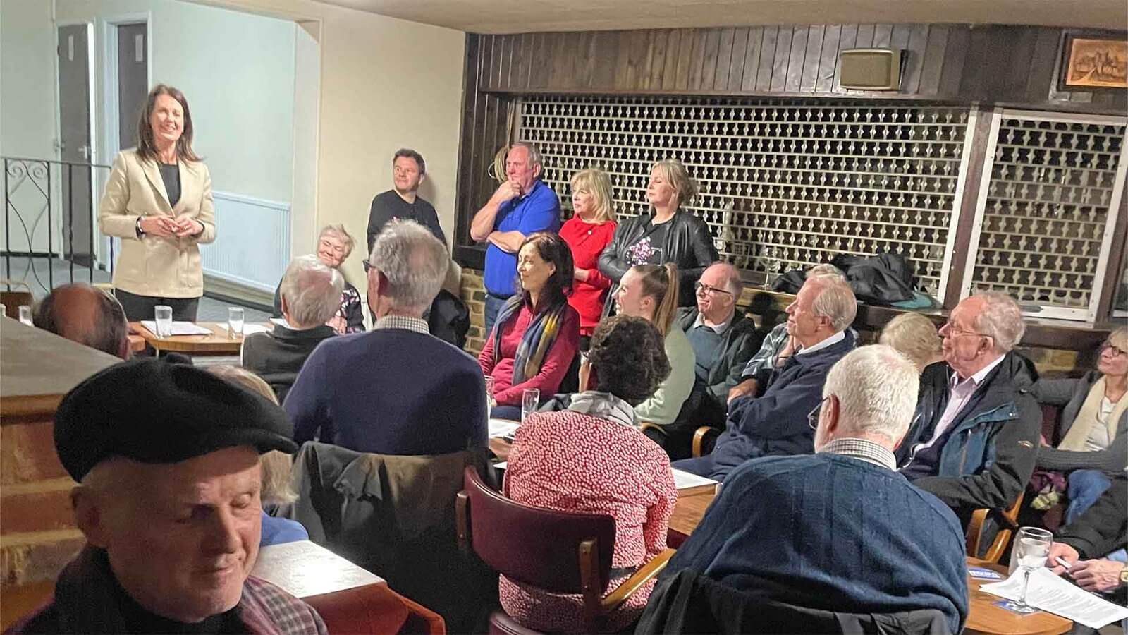 Monica Harding MP speaking at Hurst Park Residents Association Annual General Meeting at Royal British Legion with residents and committee members in attendance