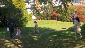 Children and parents searching for Easter eggs at Tufton Gardens during HPRA Easter Egg Hunt 2025.