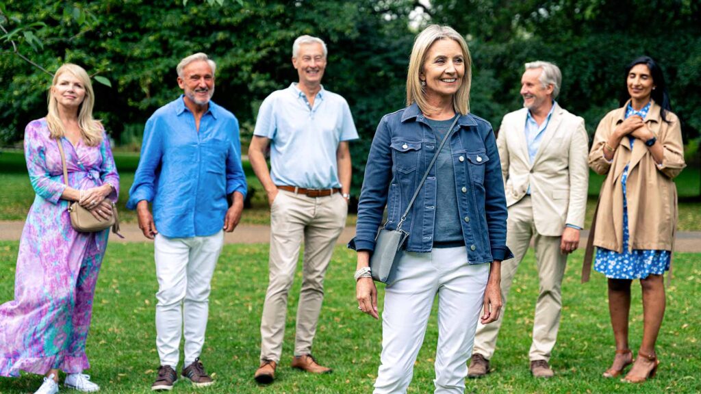Group of diverse Hurst Park residents standing confidently in a park setting, representing the HPRA committee members who advocate for community interests and ensure resident concerns are addressed.