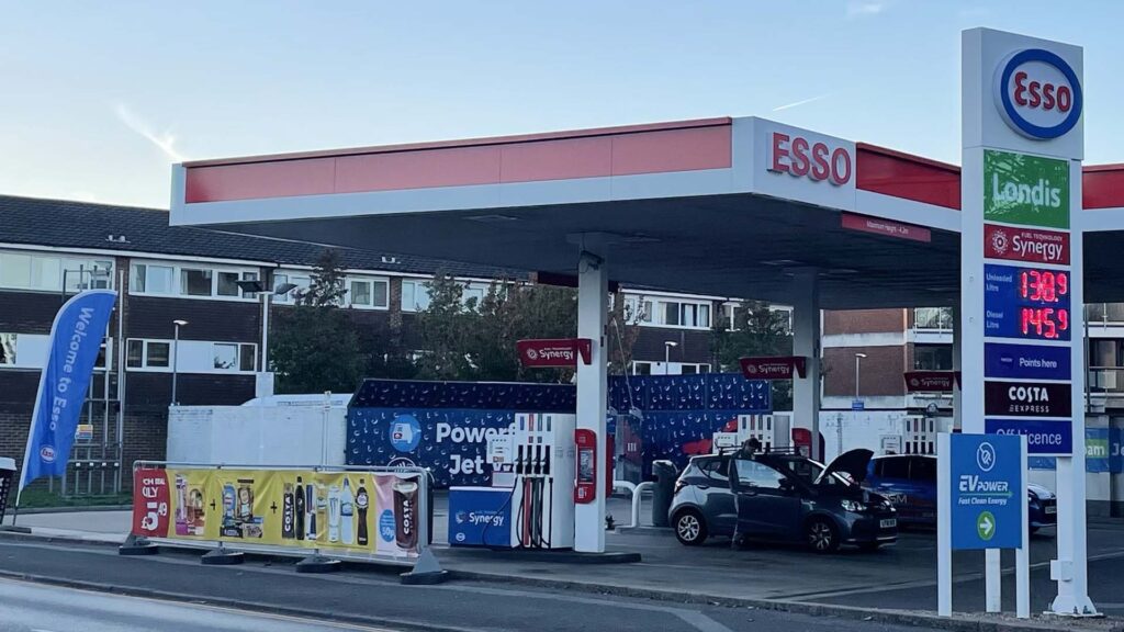 Esso petrol station on Hurst Road in West Molesey, showing the forecourt and signage related to the current planning application for a digital advertising display.