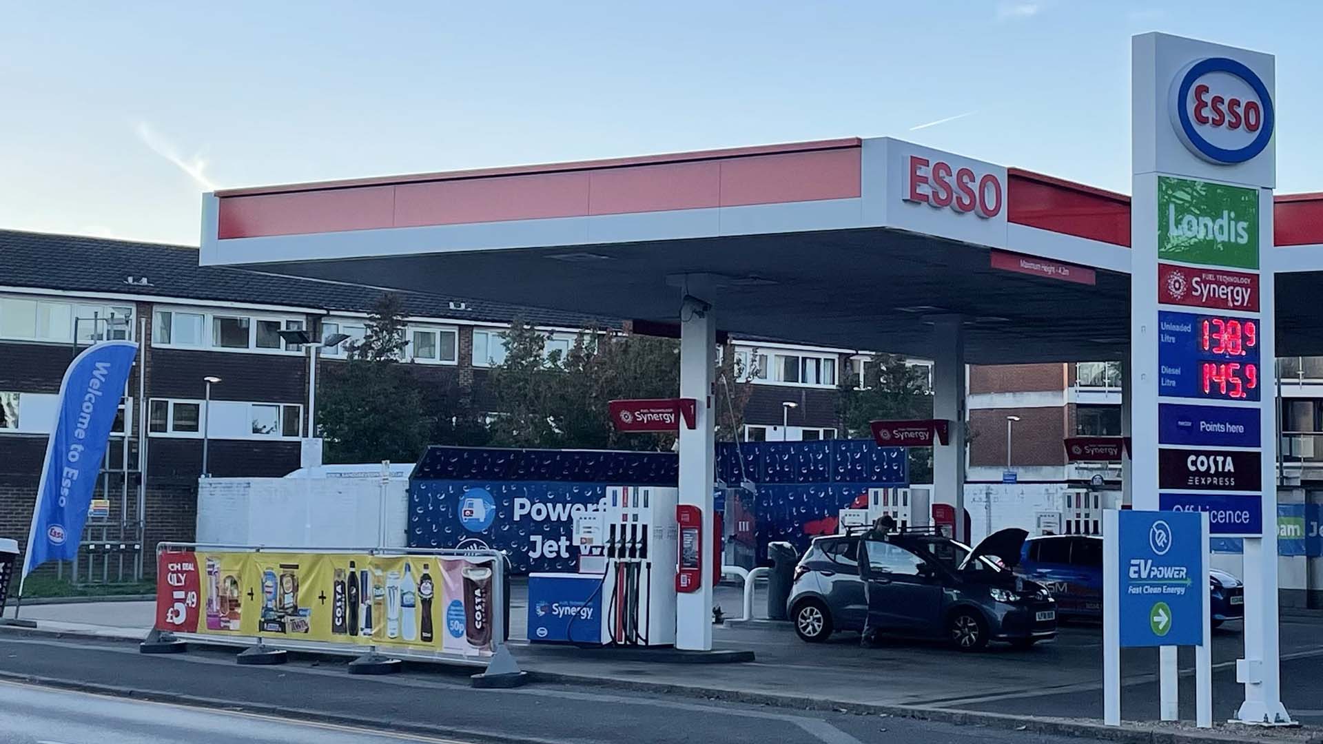 Esso petrol station on Hurst Road in West Molesey, showing the forecourt and signage related to the current planning application for a digital advertising display.